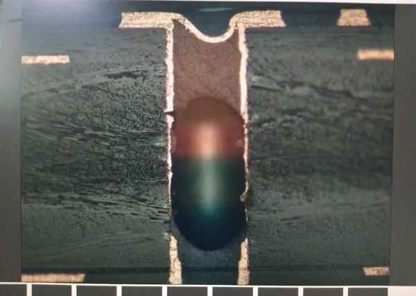 Cross-section Showing Incomplete Resin Plugging in PCB via